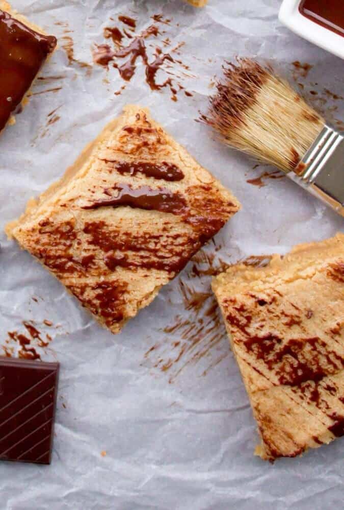 Peanut Butter Blondie Bars--brushed with dark chocolate on parchment