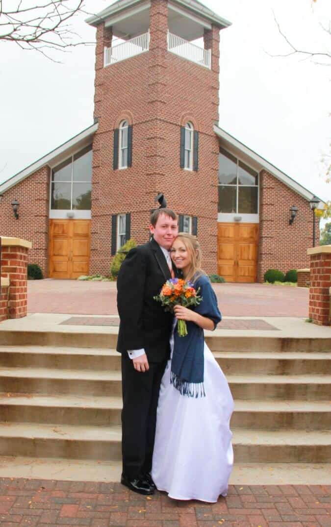 newlyweds in front of church
