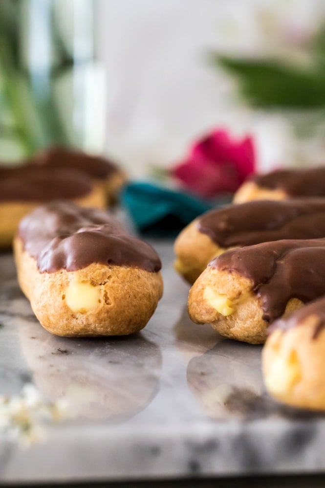 Eclairs on marble board