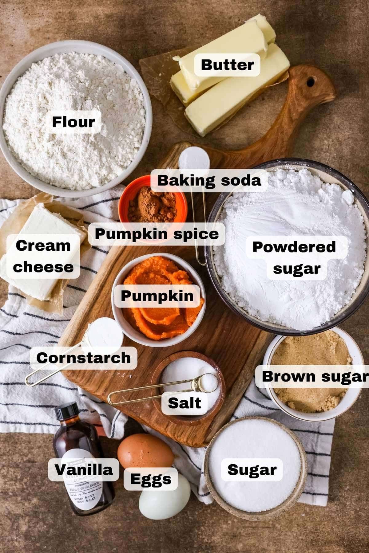 Overhead view of ingredients needed for pumpkin cookies with cream cheese frosting.