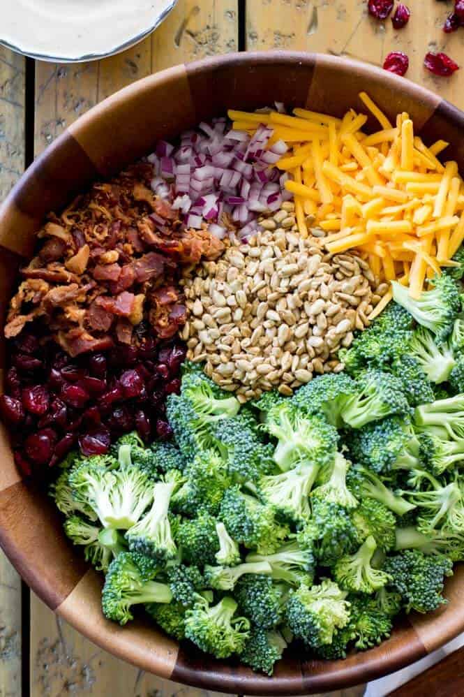 This BROCCOLI SALAD is always such a hit! Easy to make and packed with flavor! #summerfood #broccolisalad #salad #potluck Ingredients for making broccoli salad with bacon and cheese