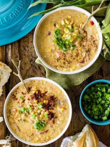 Overhead of two bowls of corn chowder