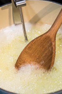 Candy thermometer in toffee mixture