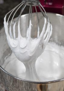 Seafoam batter on whisk in mixing bowl