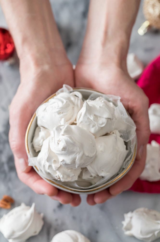 Hands holding bowl of seafoam