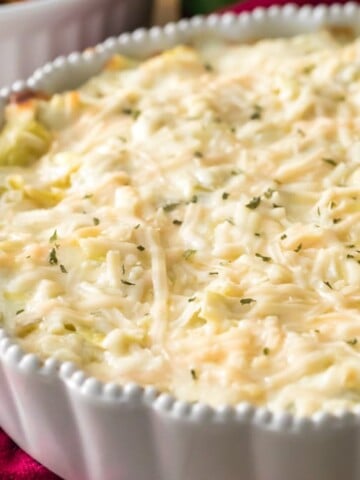 artichoke dip in white pie plate