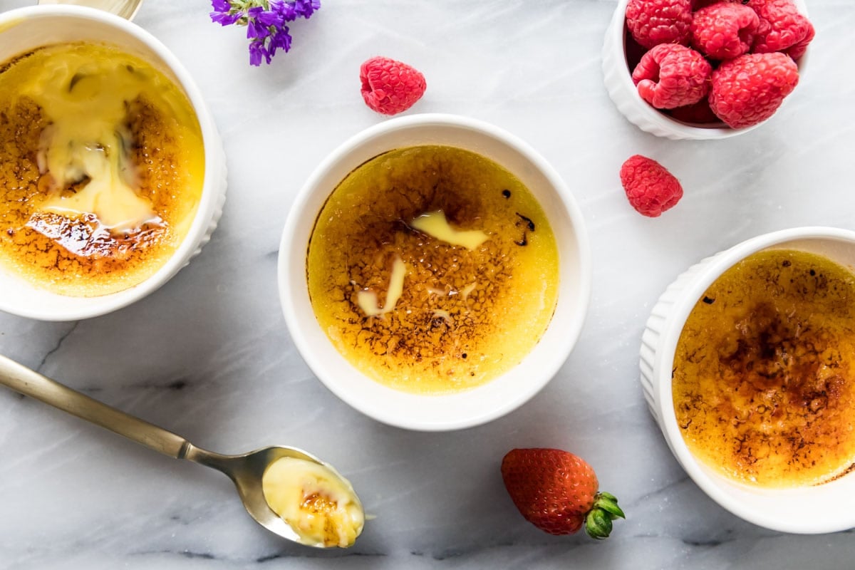 Three ramekins of creme brulee (overhead)