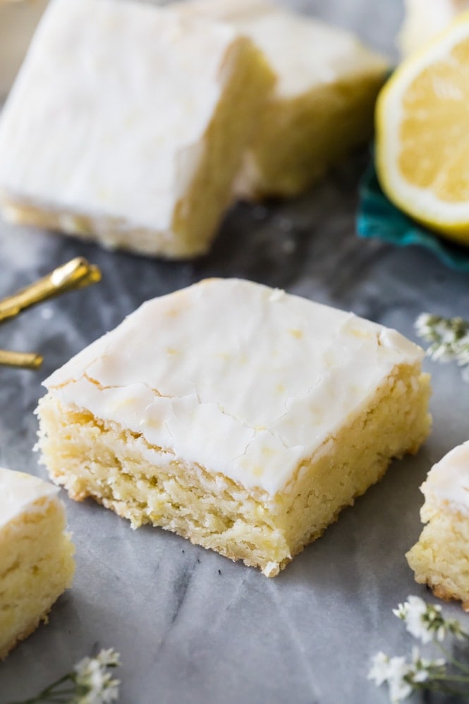 Lemon brownie with lemon glaze on white marble