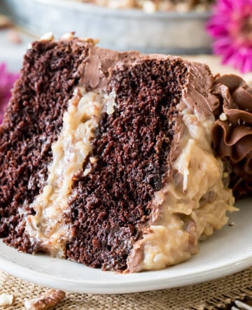 Slice of german chocolate cake on white plate