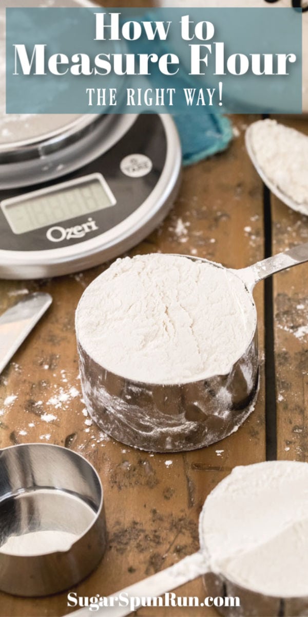cup of flour with scale behind it on wood surface