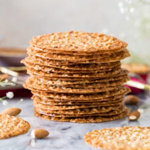 Stack of lace cookies on marble surface