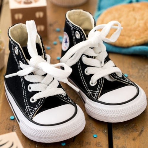 baby shoes on wood surface