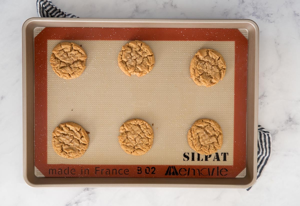 flourless peanut butter cookies on a silpat lined baking sheet