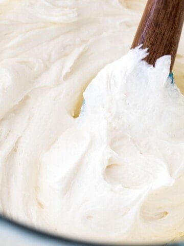 white chocolate buttercream in glass bowl with spatula