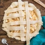 weaving a second vertical strip of pie dough