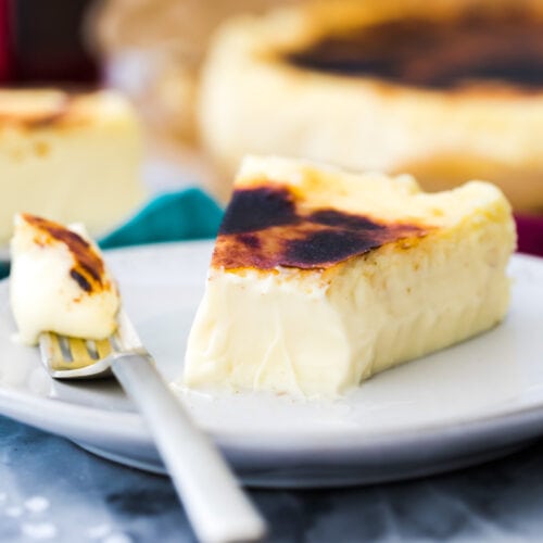 Basque cheesecake with bite taken out on a fork closeup