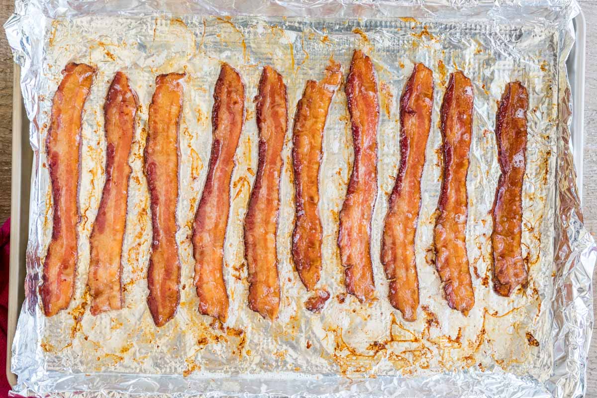 Overhead of bacon in the oven, crisp and golden brown after baking