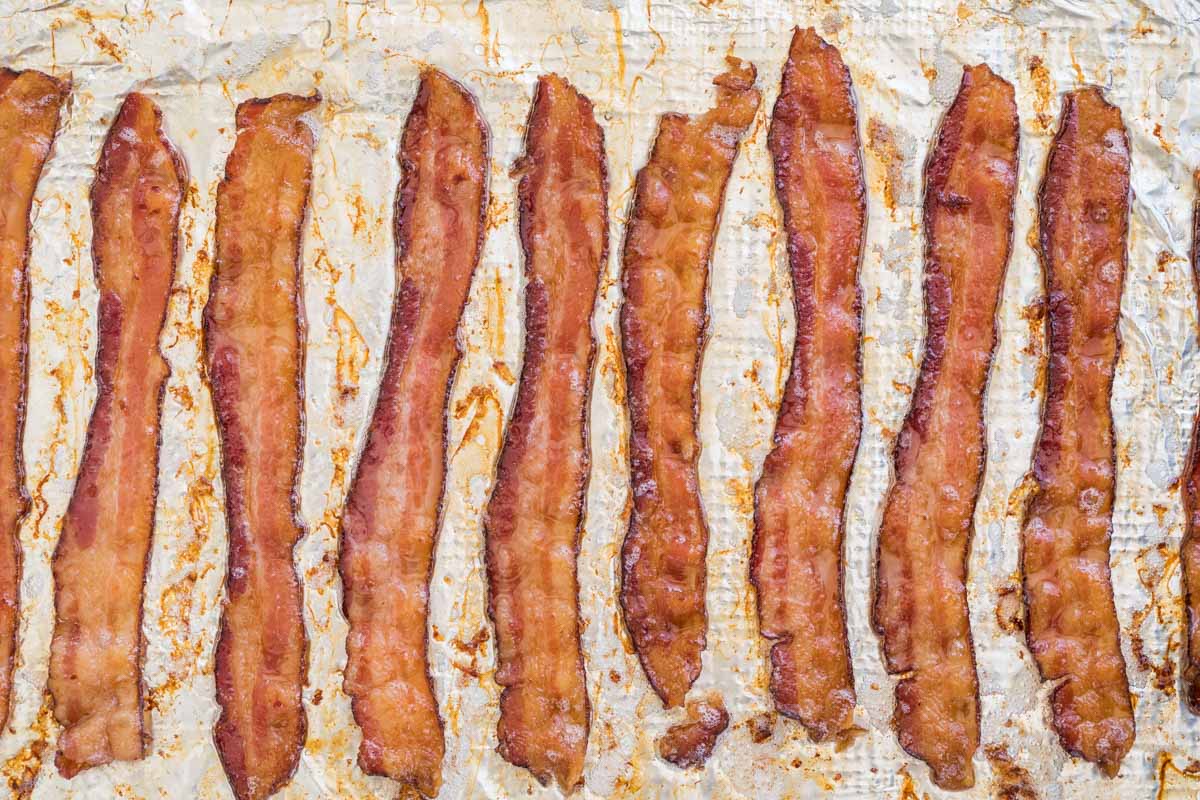 Overhead of bacon in the oven, crisp and golden brown after baking