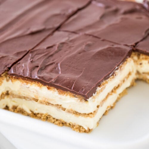 Sliced eclair cake in white baking dish