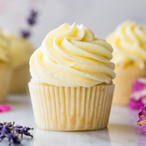 side view of cupcake frosted with thick, silky German buttercream icing