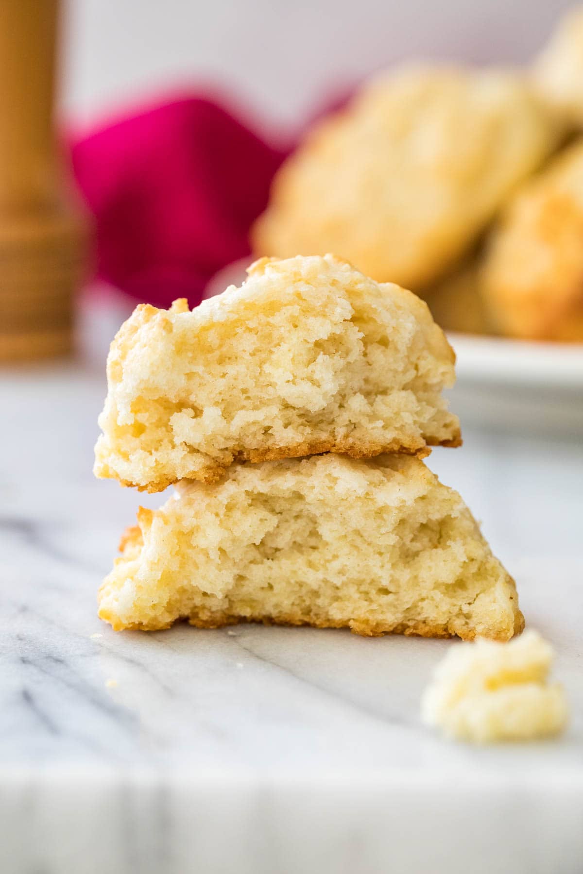 two half-eaten drop biscuits stacked on top of each other