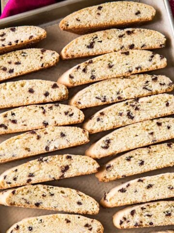 overhead view of homemade biscotti cookies cooling on a cookie sheet