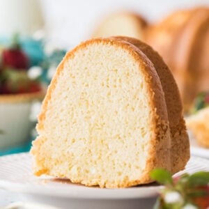 slice of sour cream pound cake on a white plate