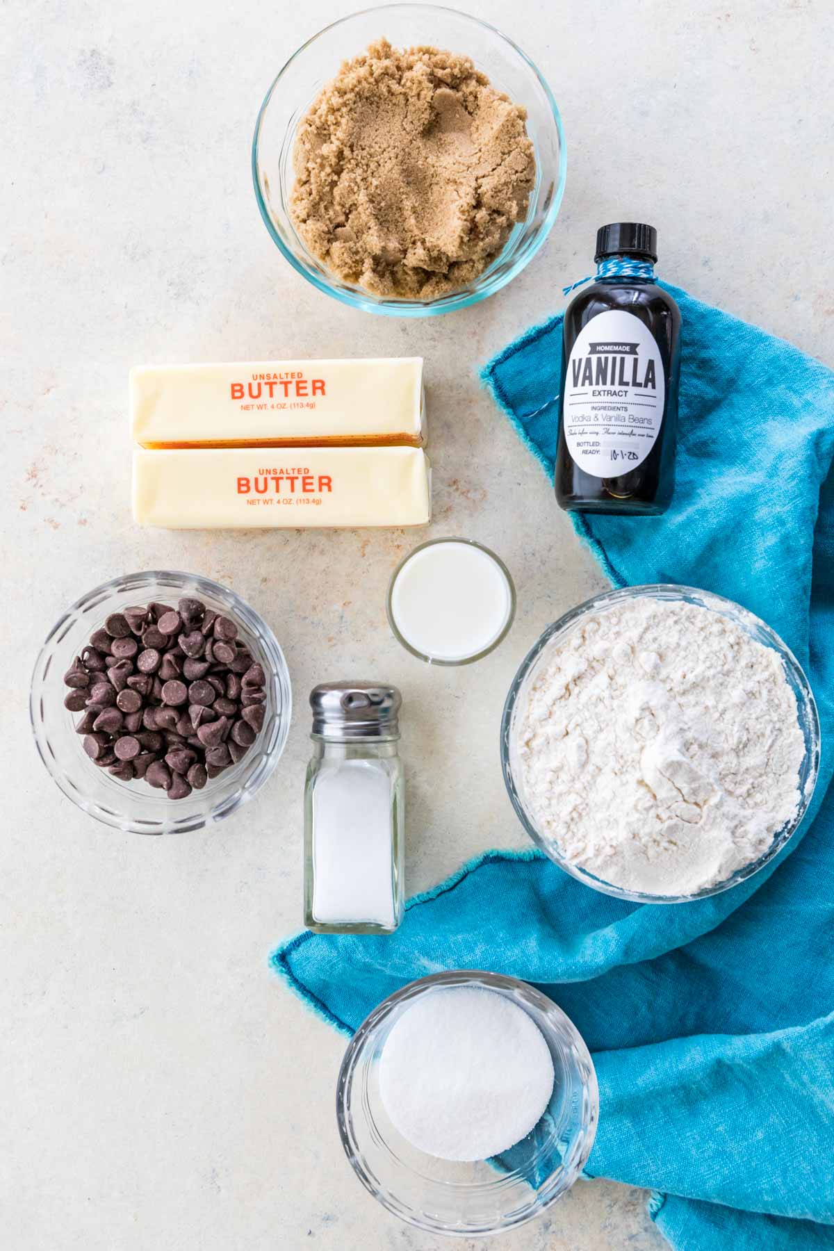 overhead view of ingredients for my edible cookie dough recipe including brown sugar, butter, vanilla, chocolate chips, and more