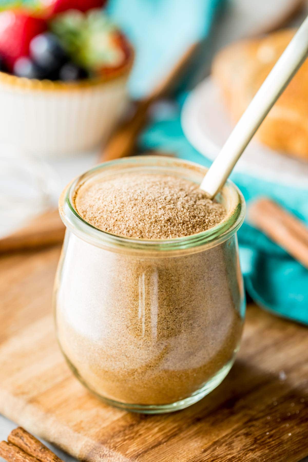 small glass jar filled with a cinnamon and sugar mixture