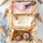 overhead view of three flavors of no churn ice cream including strawberry, vanilla, and chocolate