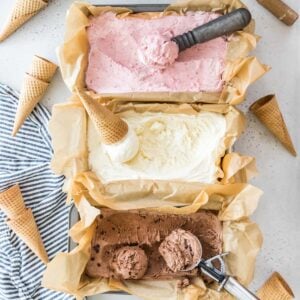overhead view of three flavors of no churn ice cream including strawberry, vanilla, and chocolate