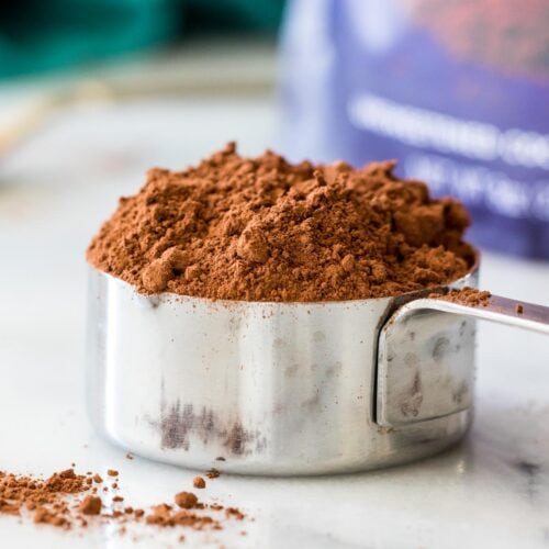 close-up view of a measuring up filled with cocoa powder