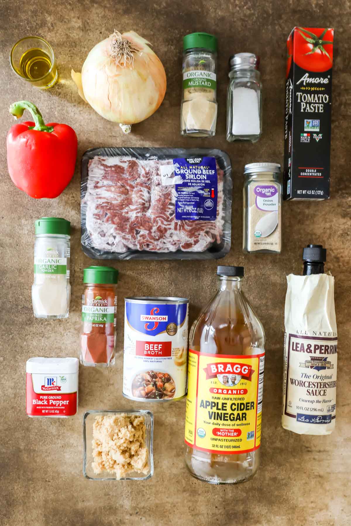 overhead view of ingredients including bell pepper, onion, ground beef, and more