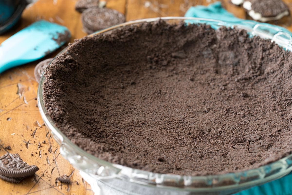 Oreo crust in a glass pie plate.