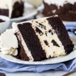 Slice of Oreo cheesecake cake on a plate.