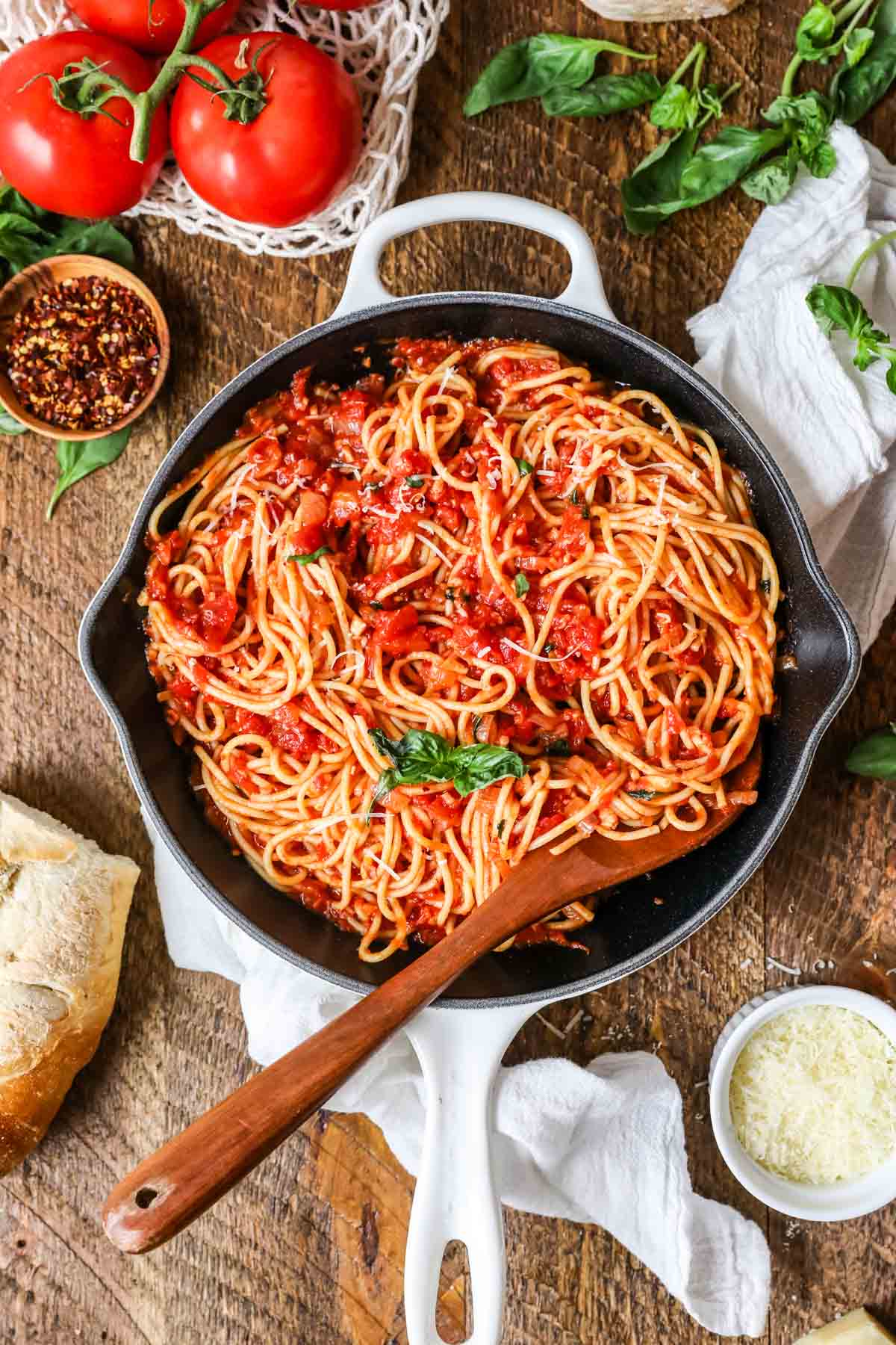 Overhead view of a skillet of pasta with arrabiata sauce.