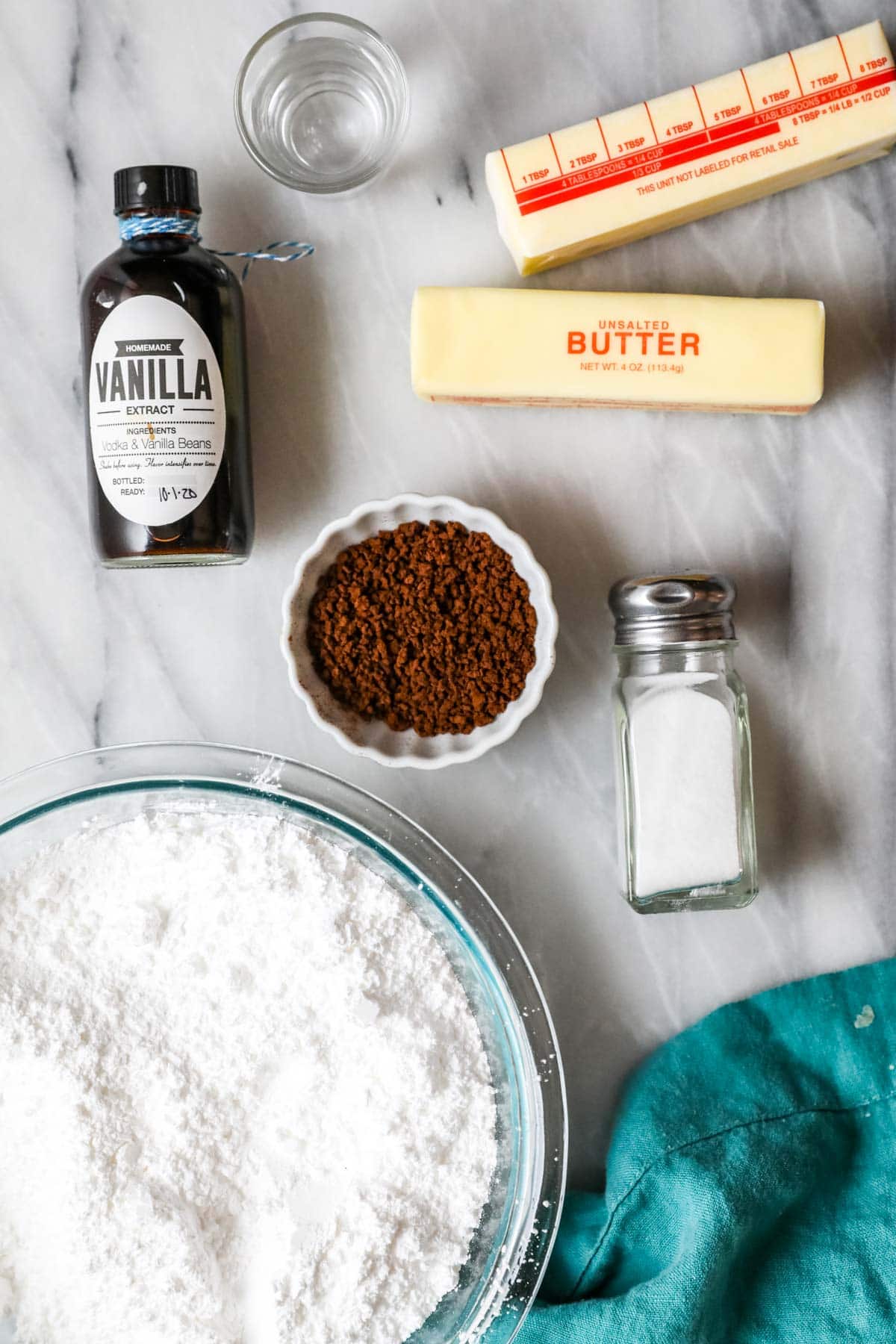 Overhead view of ingredients including butter, instant coffee, powdered sugar, and more.
