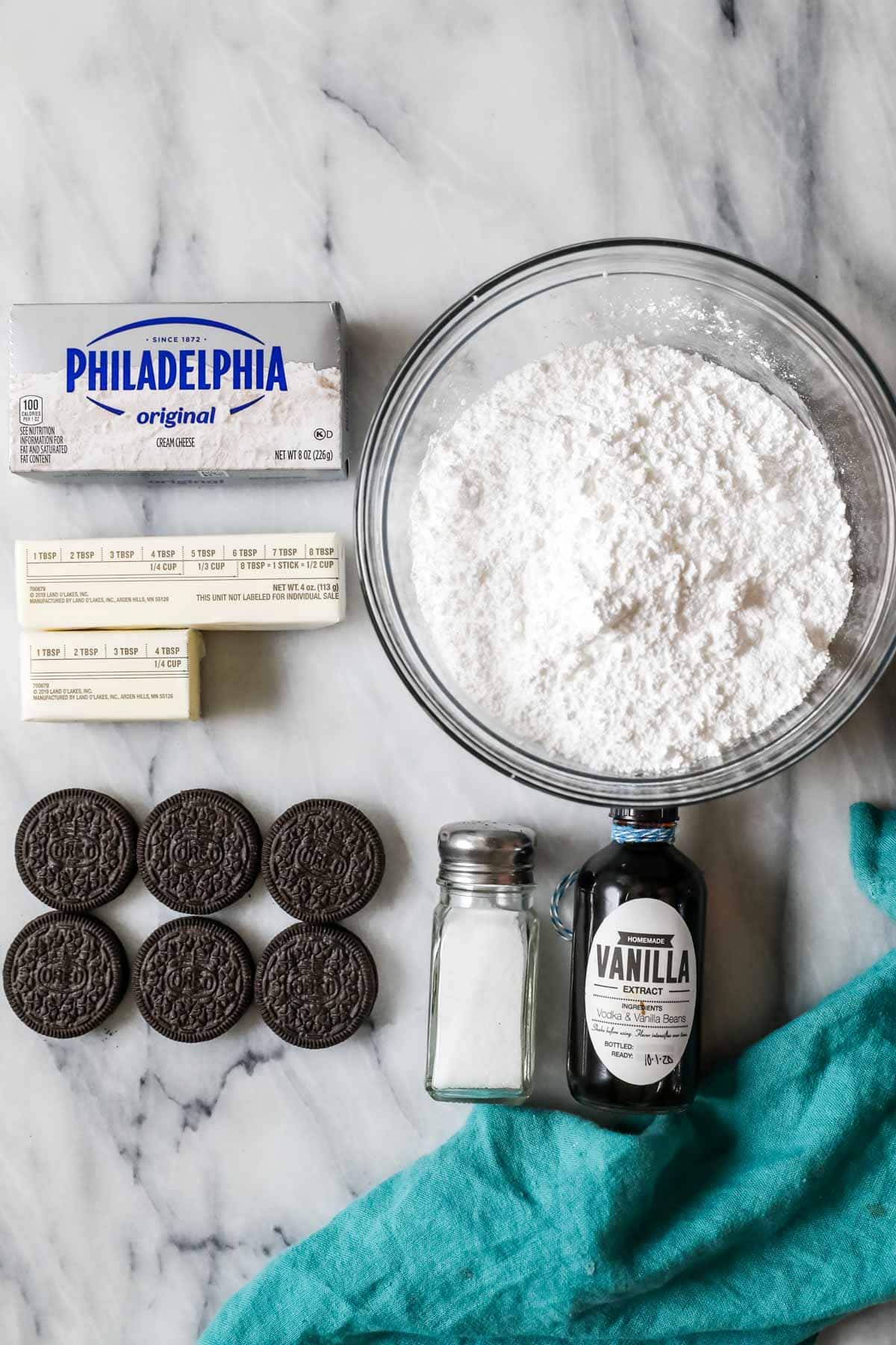Overhead view of ingredients including cream cheese, butter, Oreos, and more.