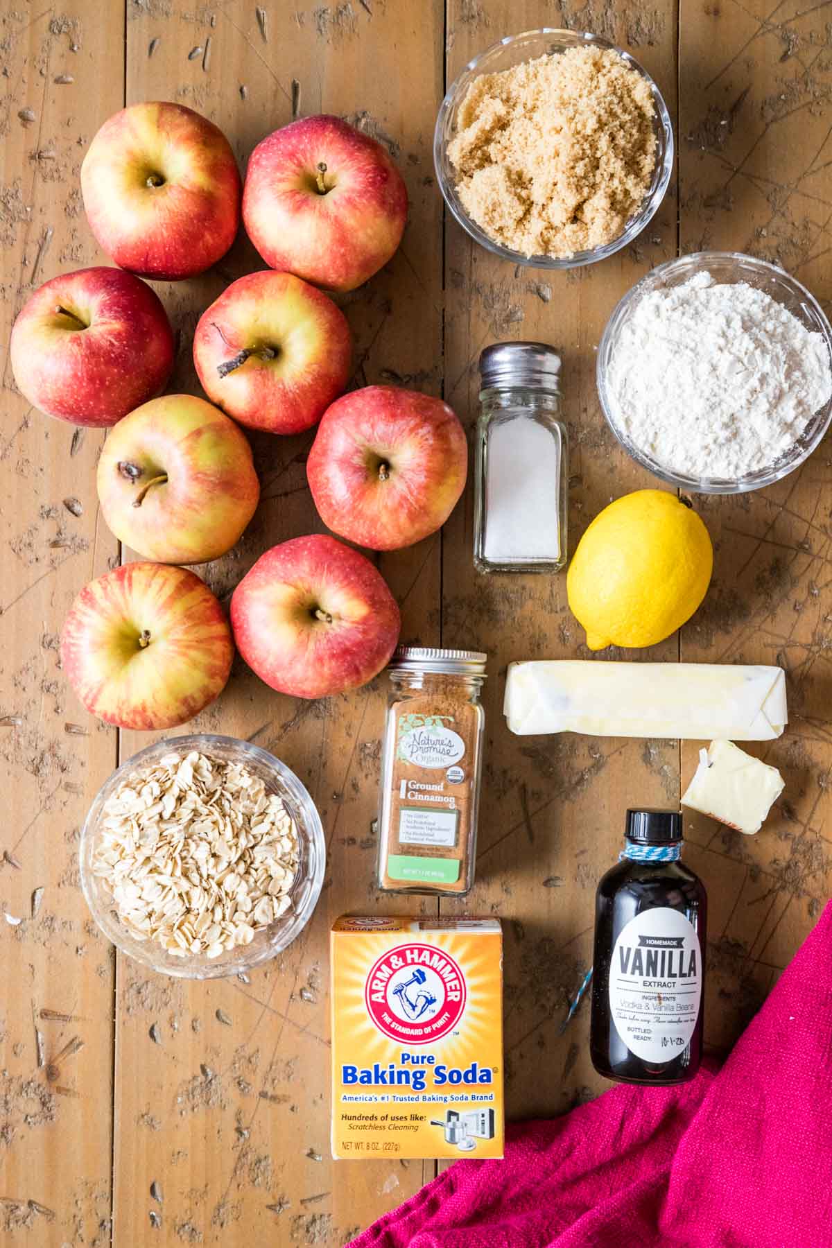Overhead view of ingredients including apples, oats, brown sugar, and more.