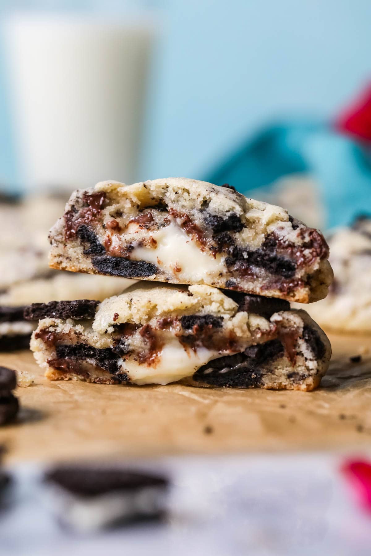 Two halves of a cheesecake stuffed Oreo cookie stacked on top of each other.