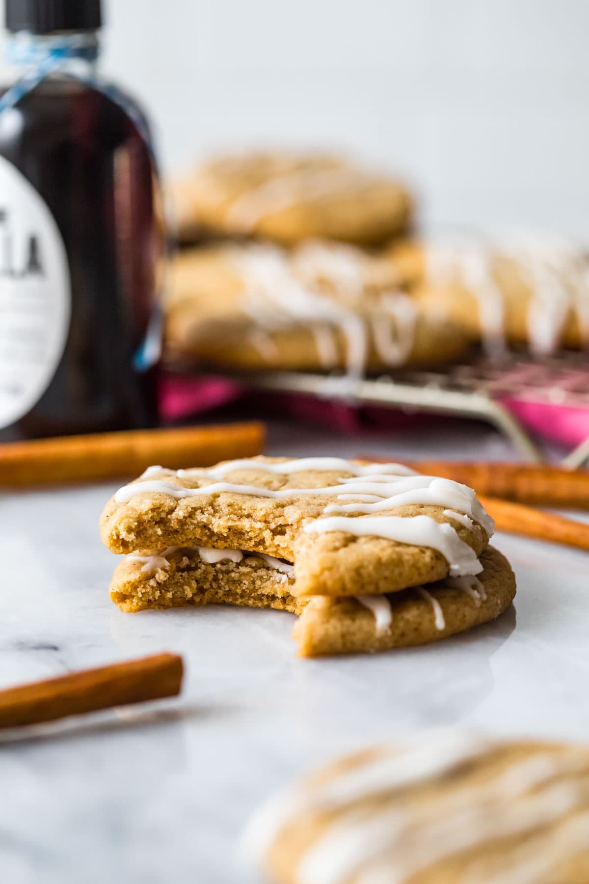 Two cookies stacked on top of each other, both missing a bite in the same spot.