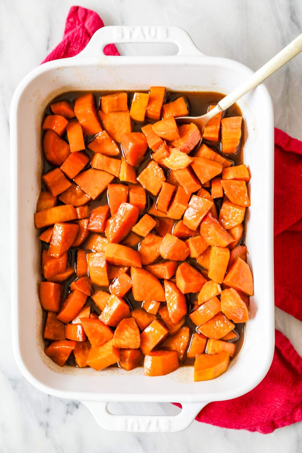 Overhead view of a casserole dish of candied sweet potatoes.