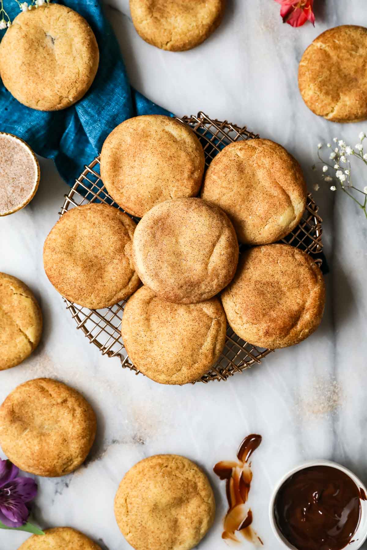 Overhead view of churro cookies on a round cooling rack.