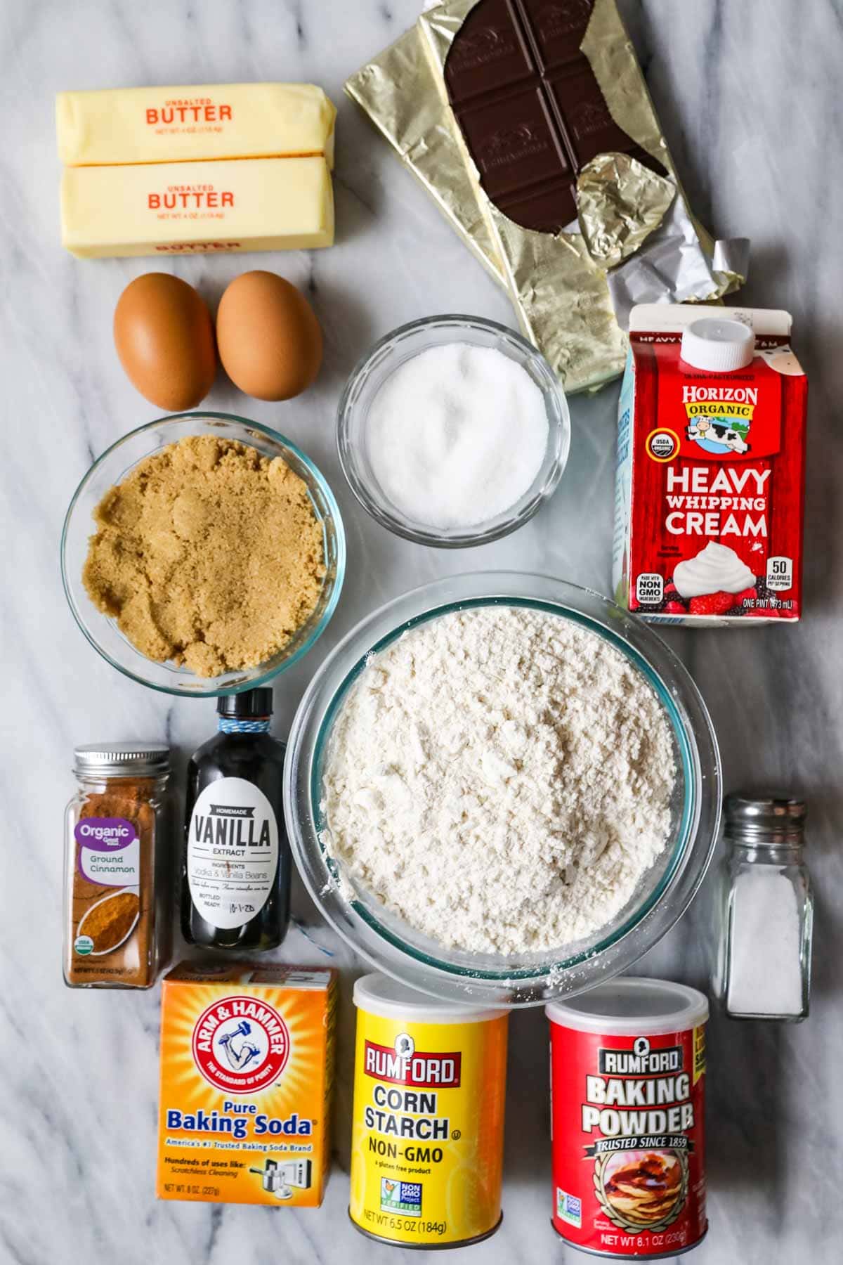 Overhead view of ingredients including chocolate, brown sugar, cinnamon, and more.