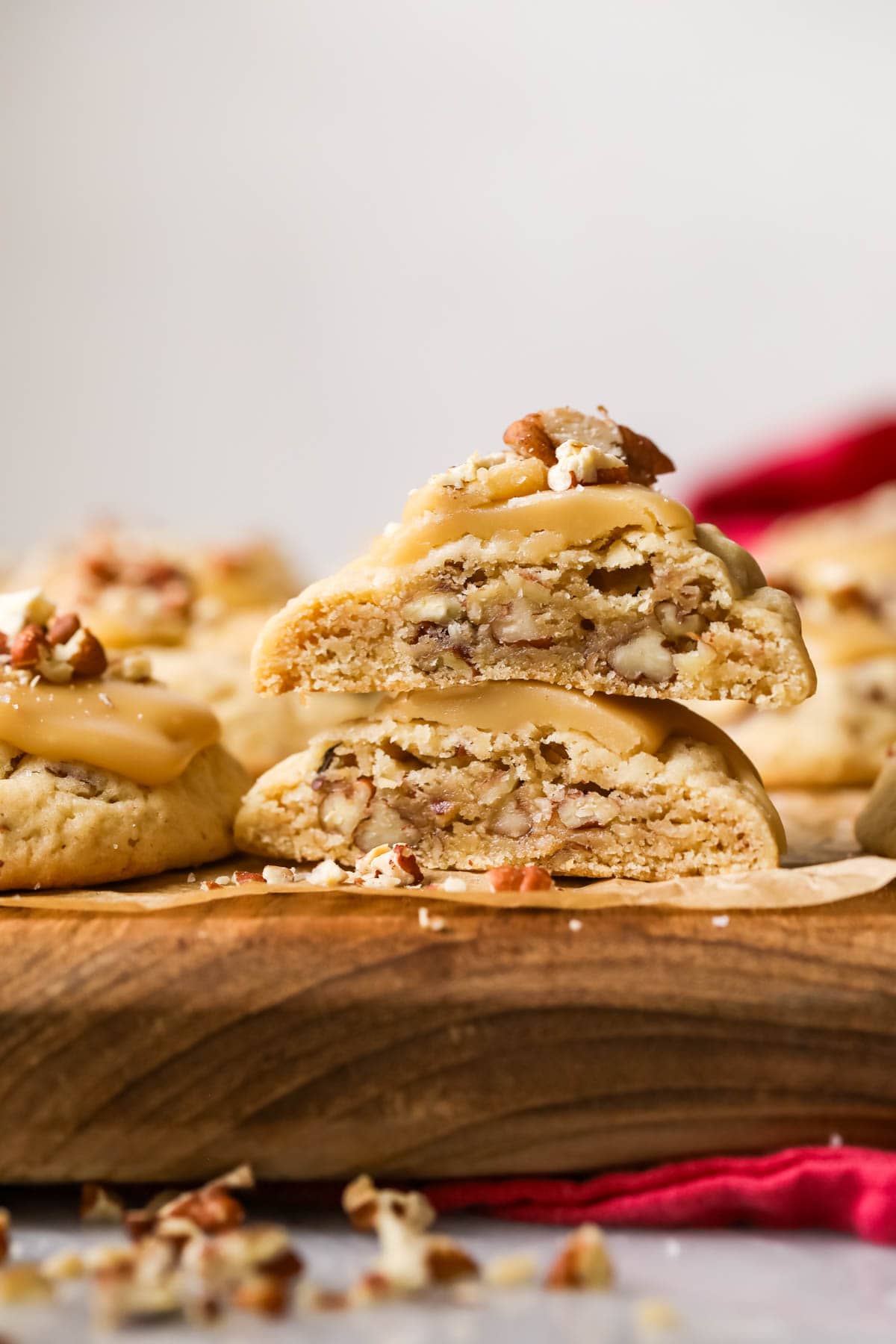 Two halves of a praline pecan cookie stacked on top of each other.