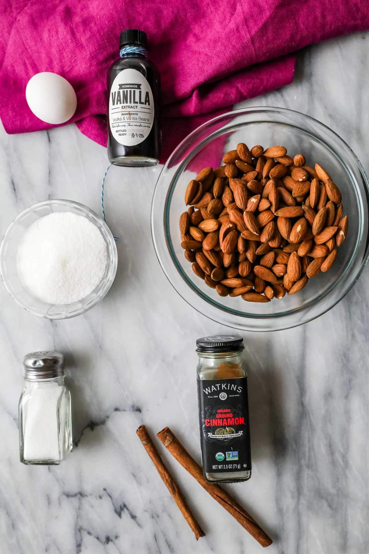 Overhead view of ingredients including almonds, cinnamon, sugar, and more.