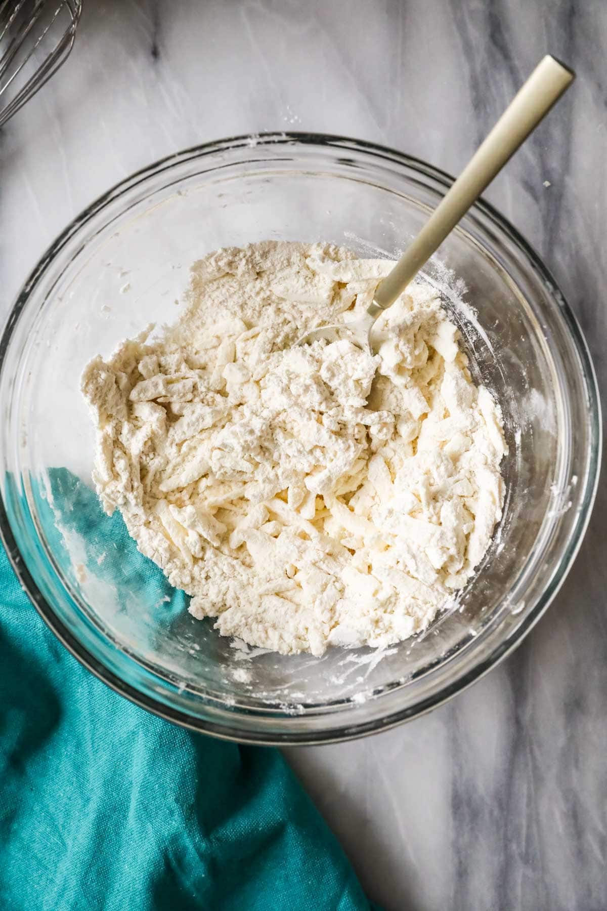 Overhead view of a bowl of biscuit dough before adding sourdough discard.
