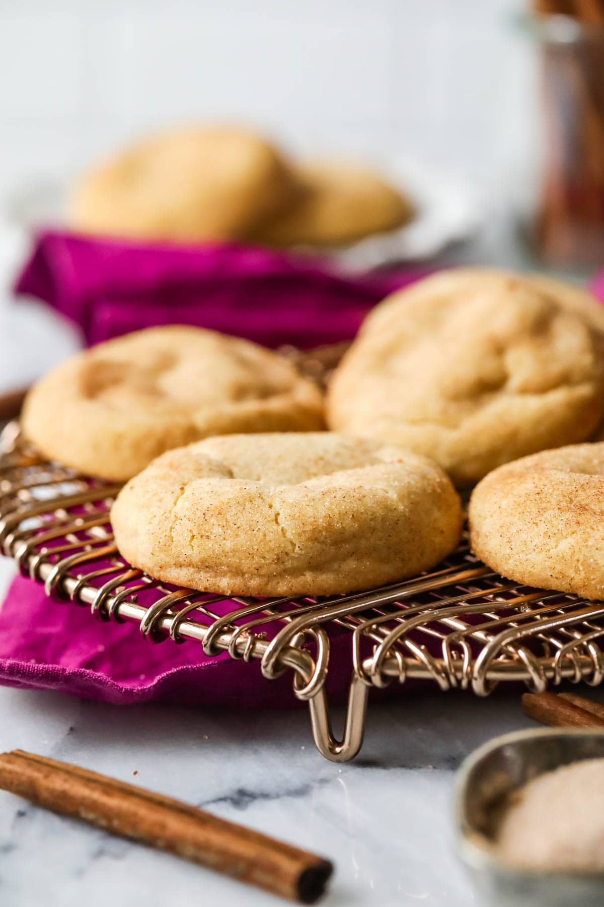 Brown butter snickerdoodles on a cooling rack.