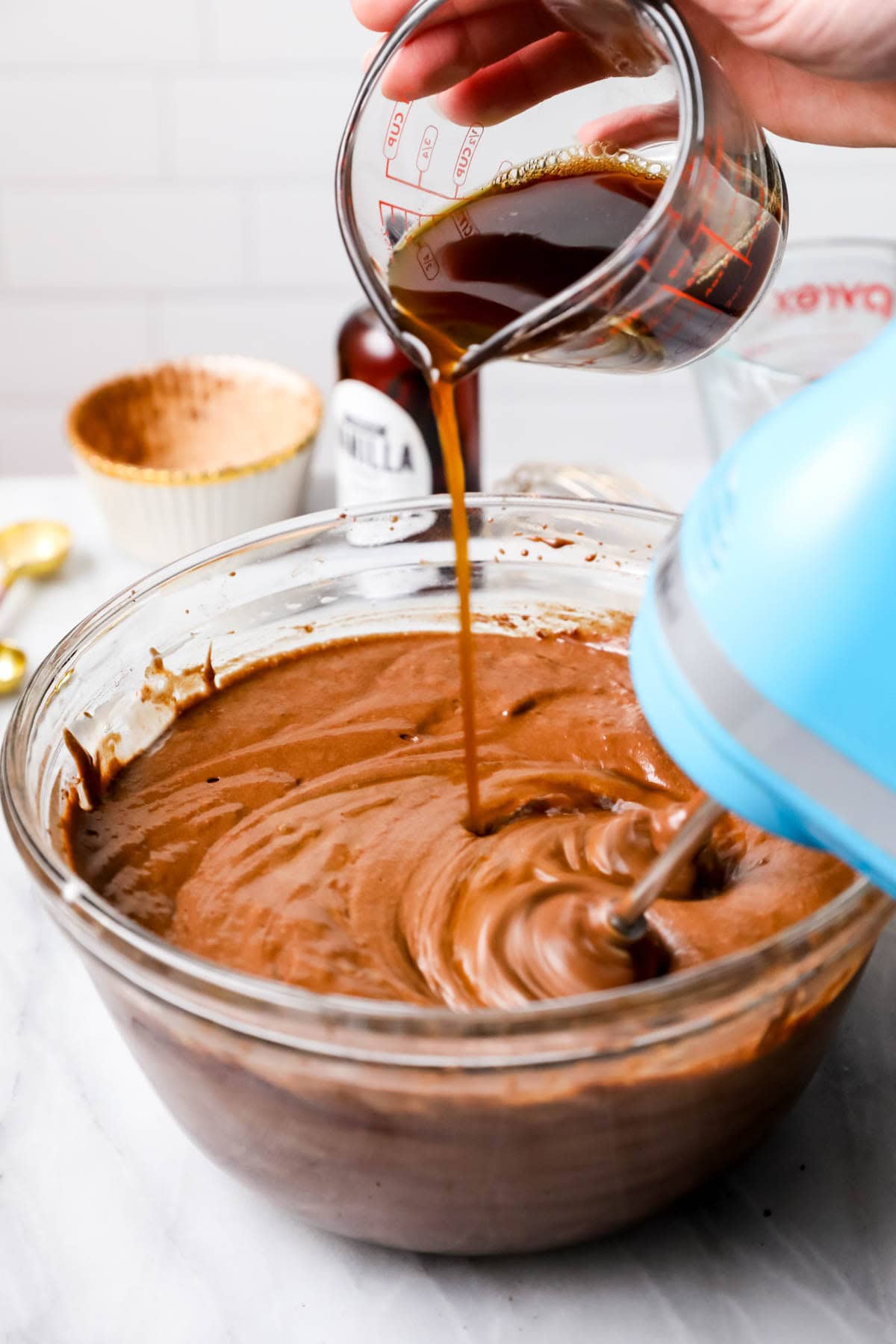 Making chocolate cake batter (adding the coffee).