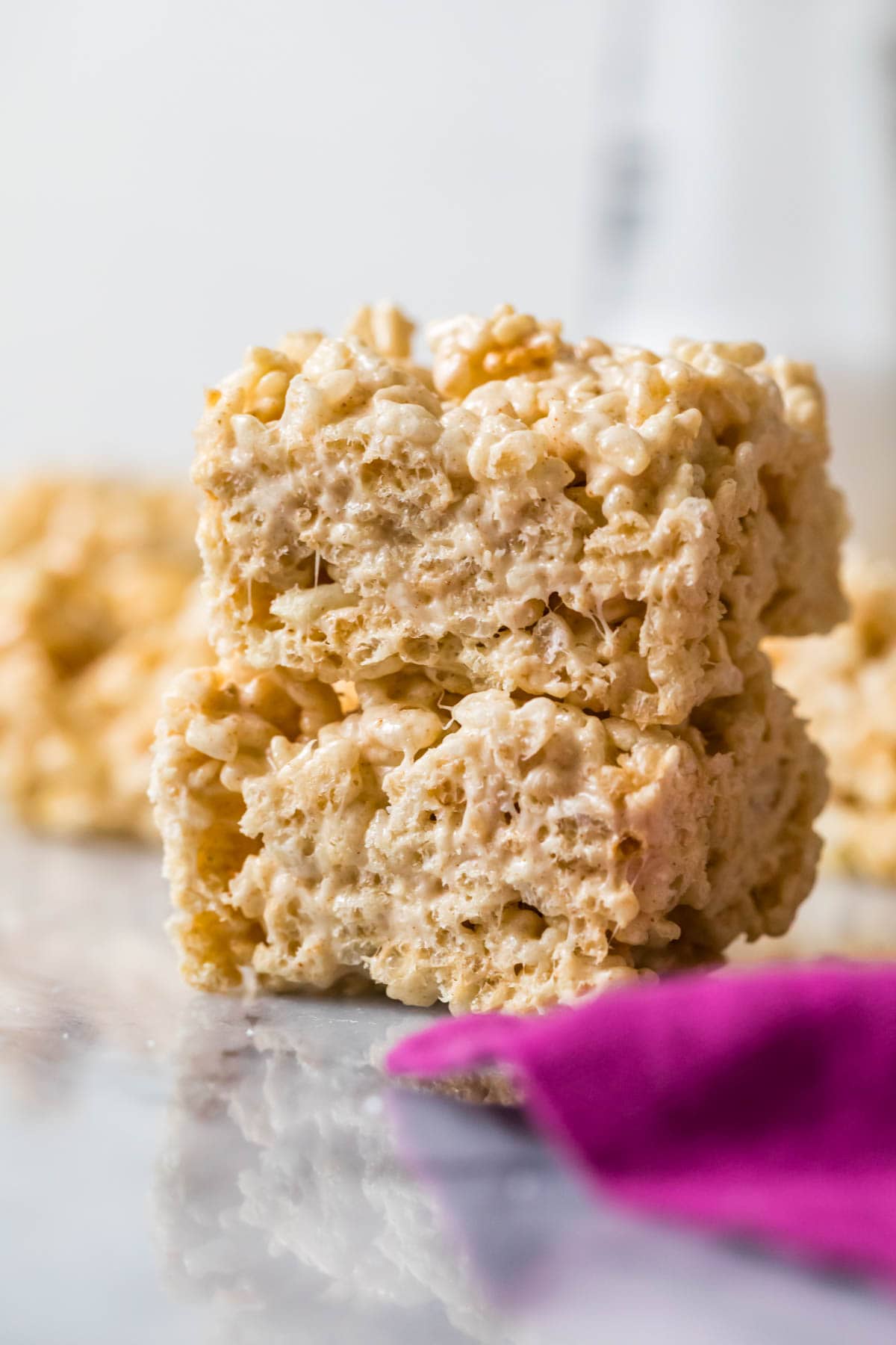 Two brown butter rice krispie treats stacked on top of each other.